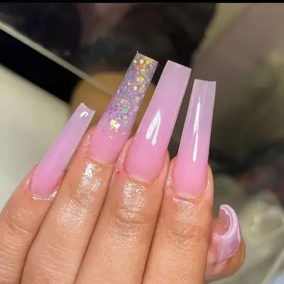 Acrylic nails with pink sparkles