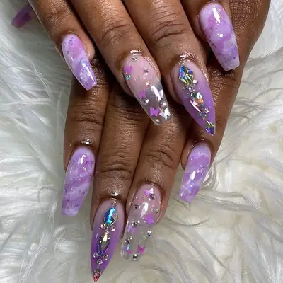 Bedazzled purple acrylic nails 