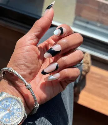 Long almond-shaped acrylic nails with tortoiseshell design