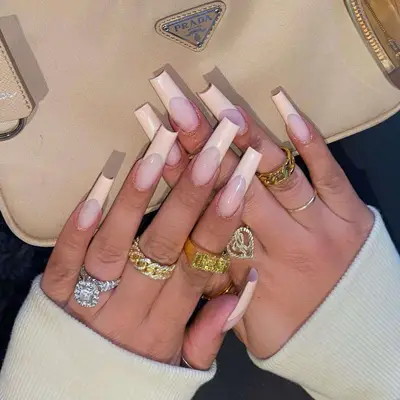 A coffin vanilla French manicure. 