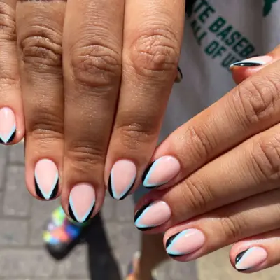 Double French manicure with geometric tips.