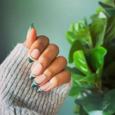 Double French manicure with forest green tips.