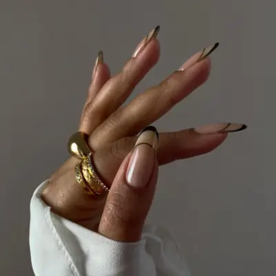 French manicure with the tips outlined in black.