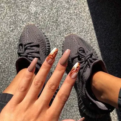 Muted brown short coffin nails with brown and white latte swirl accents