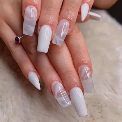 Translucent milky white short coffin nails with some solid and some marbled