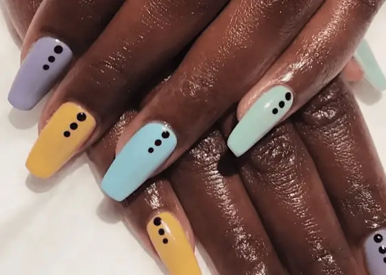 woman with dotted short coffin nails manicure