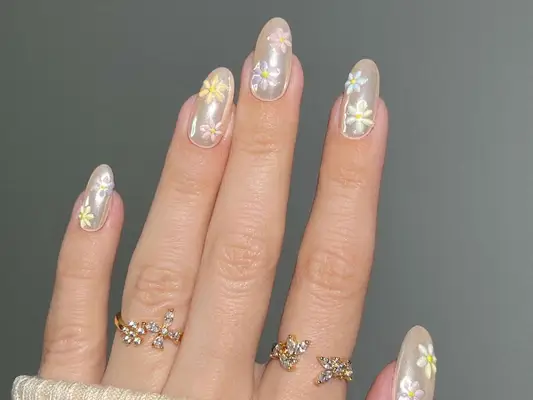 Vanilla chrome manicure with pastel floral designs