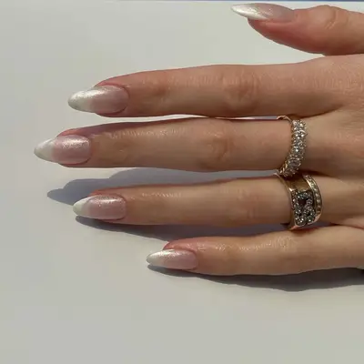 model with silver iridescent chrome nails