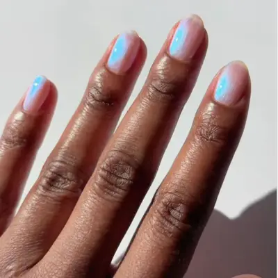model with pink and blue duochrome nails