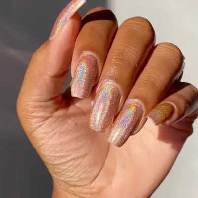 model with rainbow iridescent nails