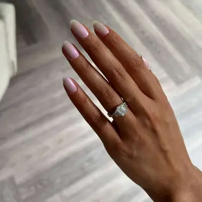 model with pink nails with blue chrome shift