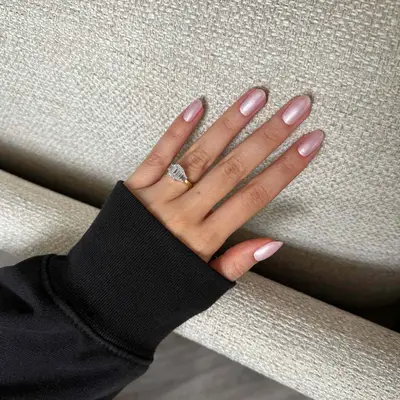 model with pink frosted chrome nails
