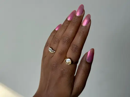 model with pink iridescent nails