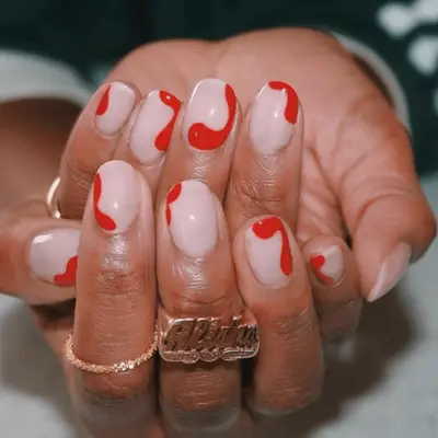 Silver nails with red pointsettia designs