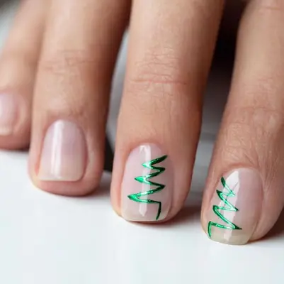 Clear nails with half-and-half green Christmas tree outline design