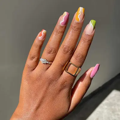 Outlined squiggle halfsie nails with orange, mauve, mustard, and lime accents - MYM Beauty Halfsie Manis