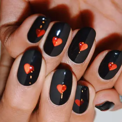 Dual finish black halfsie nails with red heart accents - MYM Beauty Halfsie Manis