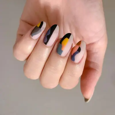 Matte abstract halfsie nails in shades of black, brown, gray, and mustard - MYM Beauty Halfsie Manis