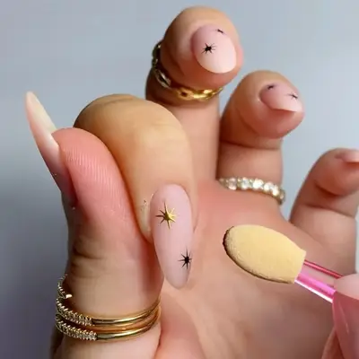 Neutral matte manicure with gold chrome sparkle nail designs