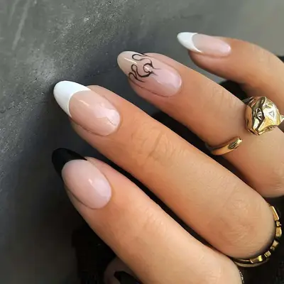 a french manicure with a negative space flame tip
