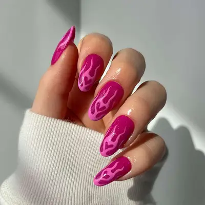 a hot pink manicure with bubblegum pink heart flames