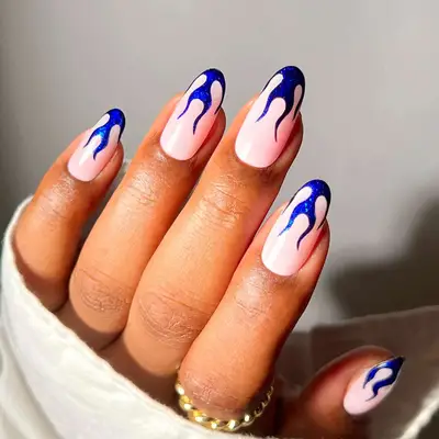a manicure with sapphire flame french tips