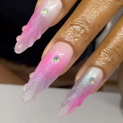 Shimmery pink manicure with 3D shell details and gem accents