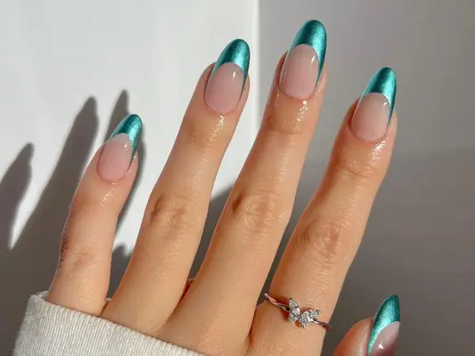 Manicure with mermaid teal metallic French tips
