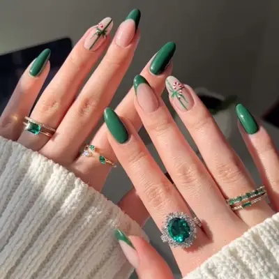 manicure with green christmas nails, one nail french, once nail wrapped as present with candy cane