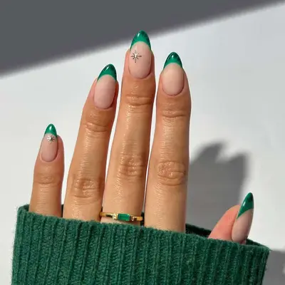 a manicure with slim emerald green croc french tips