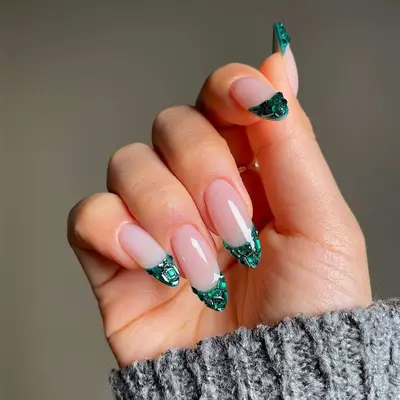 emerald green french tips with gemstone accents
