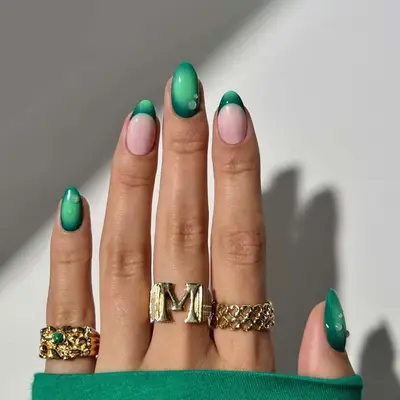 an aura manicure with solid and french tip fingers