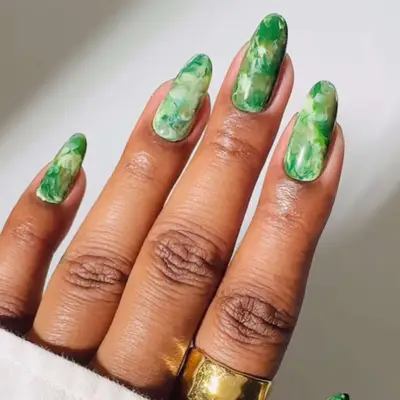 a white and green marble manicure