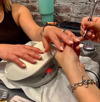 woman getting nails painted