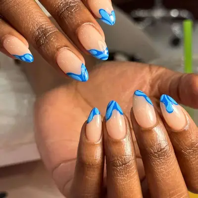woman with blue wavy manicure