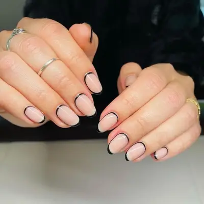woman with black outline manicure