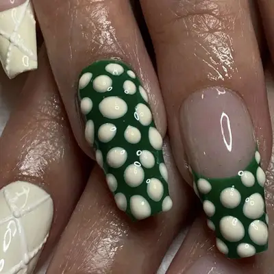 Green nails with white spots