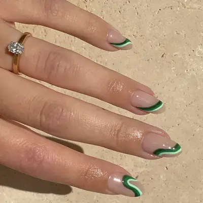 A manicure with wavy green accents