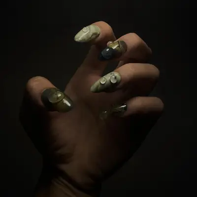 A green manicure with 3D builder gel dewdrop details