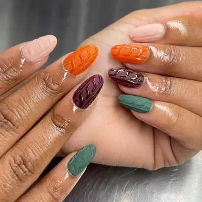 Close-up of colorful sweater manicure