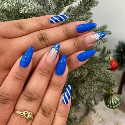 Close-up of royal blue sweater nails