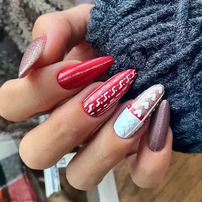 Close-up of red and white sweater nails