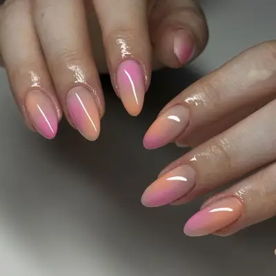 pink orange ombre airbrush manicure closeup