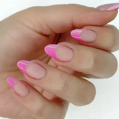 bright pink ombre tips manicure closeup