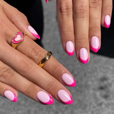 A bubblegum pink french manicure with hot pink tips