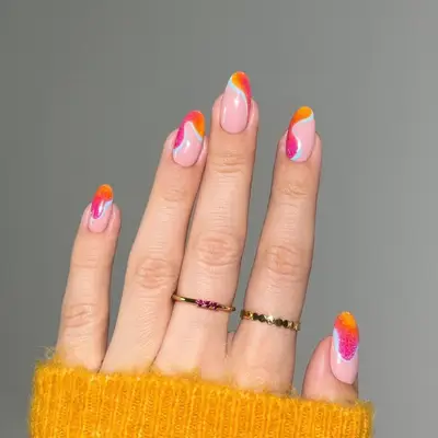 Swirl nails with orange, scarlet, and fuchsia polish 