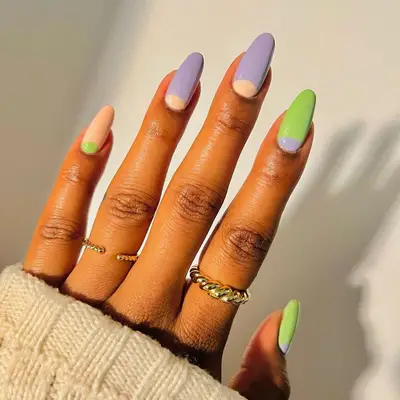 Pastel lavender, sage and peach nails with half moon designs