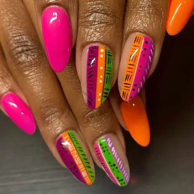pink and orange manicure with accent designs