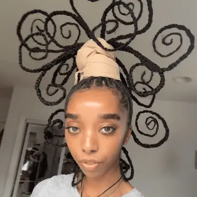 model with sculpted braids