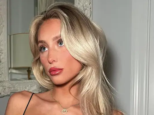 alix earle wearing shiny berry-colored lip